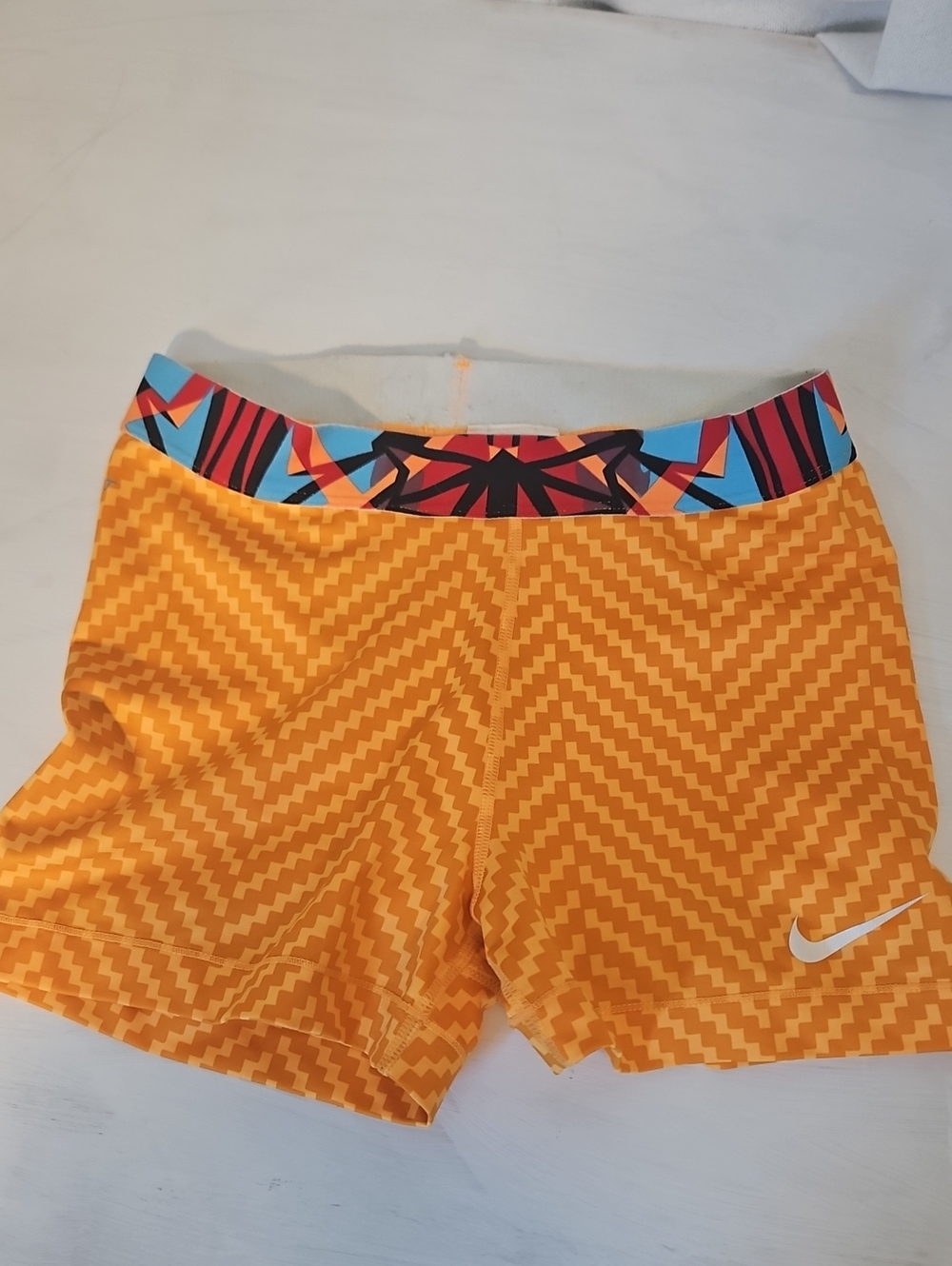 Nike Women's Orange Geometric Athletic Shorts with Multicolor Waistband